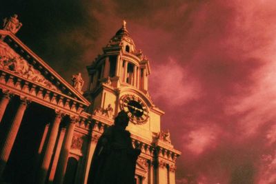 Low angle view of church against cloudy sky