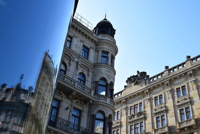 Low angle view of buildings against clear sky