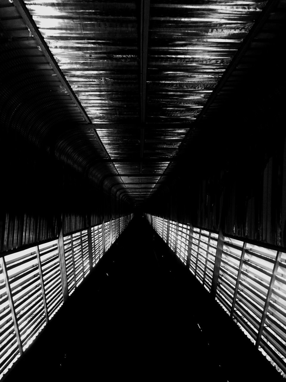 architecture, built structure, indoors, the way forward, railing, diminishing perspective, modern, illuminated, pattern, low angle view, city, connection, bridge - man made structure, building exterior, no people, shadow, vanishing point, repetition, ceiling, in a row