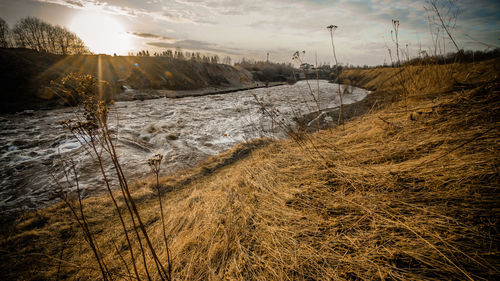 Scenic view of land against sky during winter