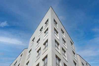 Exterior of modern white house, bottom and angle view. real estate, residential apartment and office