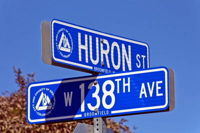 Close up view of street blue street sign.