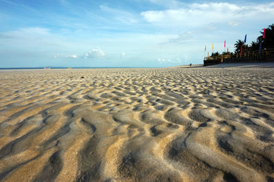 Idyllic view of sandy beach against sky