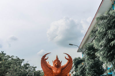 Low angle view of statue against sky