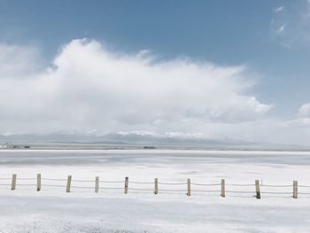 Scenic view of sea against sky during winter