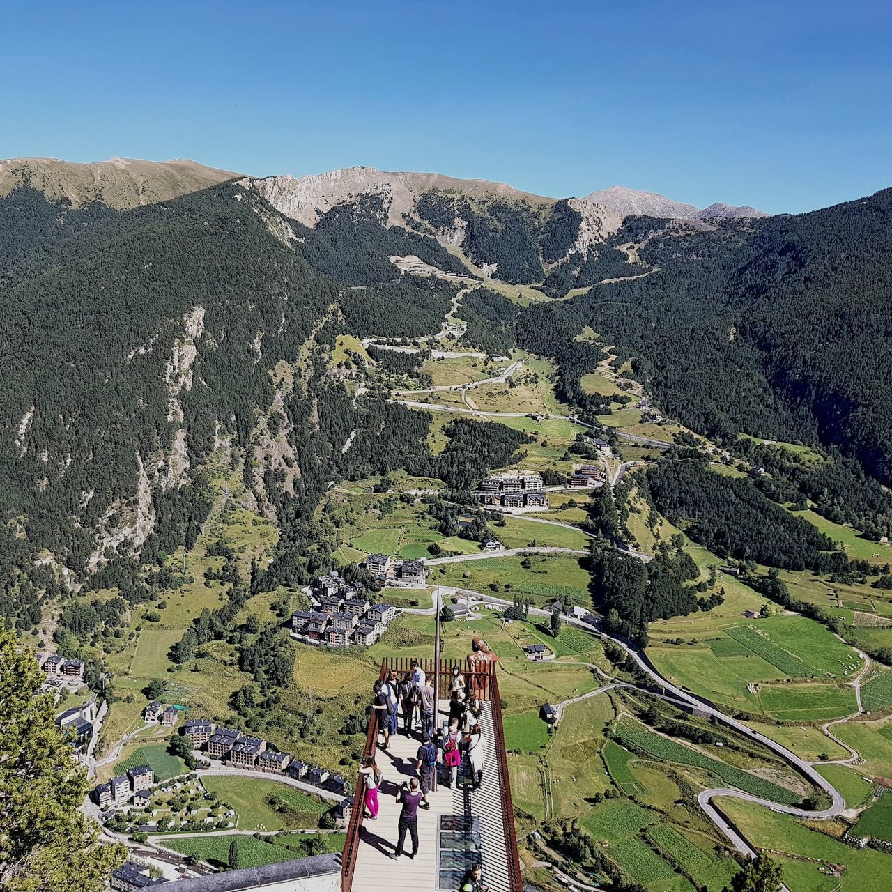 HIGH ANGLE VIEW OF PEOPLE WALKING ON MOUNTAIN RANGE