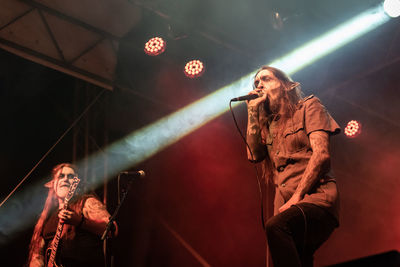 Young couple looking at illuminated stage