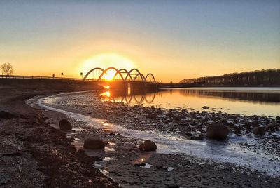 Scenic view of sunset over river