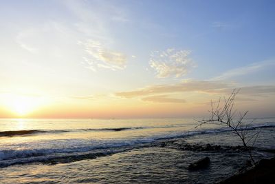 Scenic view of sea against sky at sunset