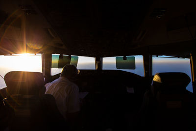 Pilot sitting on cockpit