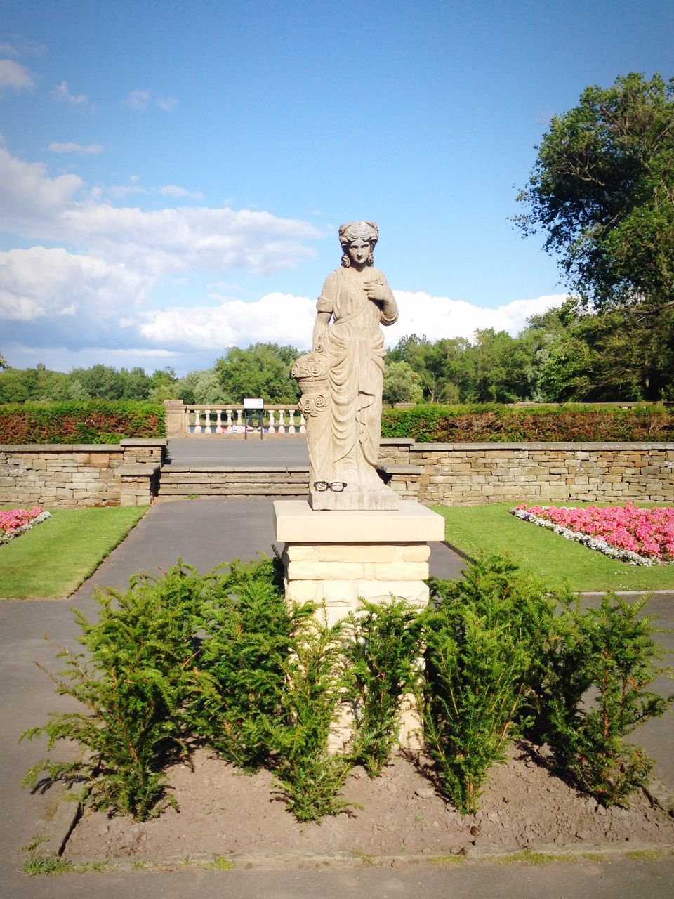 human representation, art and craft, statue, art, sculpture, creativity, tree, sky, animal representation, plant, green color, craft, carving - craft product, monument, growth, park - man made space, day, memorial