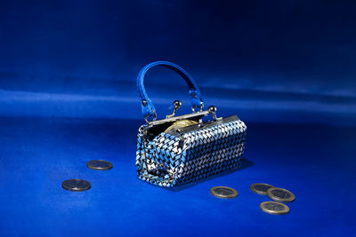 Close-up of ring on table against blue background