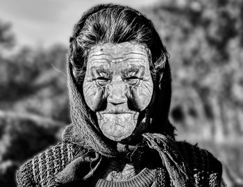 Portrait of woman against blurred background