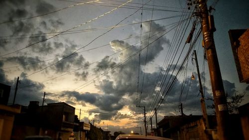 Low angle view of building against cloudy sky