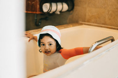 Portrait of girl in bathroom at home