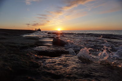 Scenic view of sea against sky during sunset