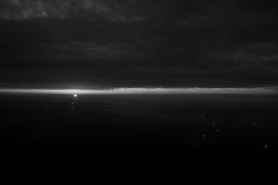 Scenic view of sea against sky at night