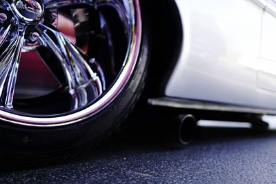 Close-up of vintage car on road