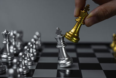 Low angle view of man playing on chess board