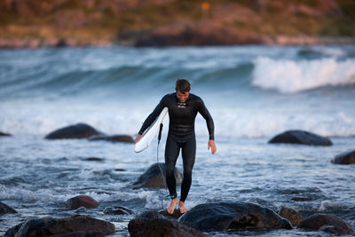 Full length of man walking at beach