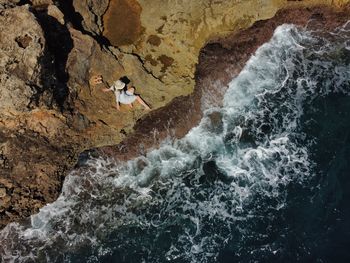 High angle view of man surfing in sea