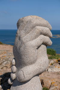 Close-up of stone sculpture on beach