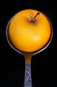 Close-up of fruit over white background