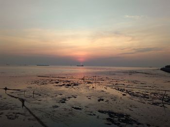 Scenic view of sea against sky at sunset