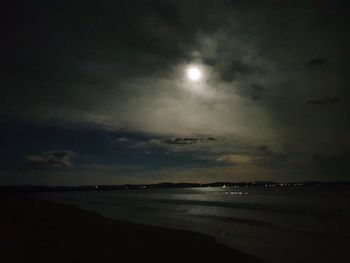 Scenic view of sea against sky at night