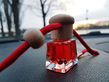 Close-up of red toy car on table