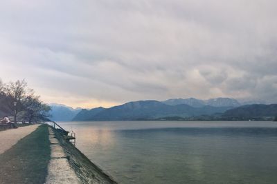 Scenic view of mountains against cloudy sky