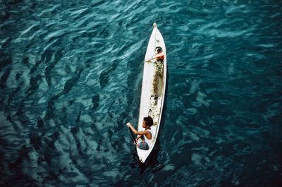 High angle view of woman boy on boat sailing in sea