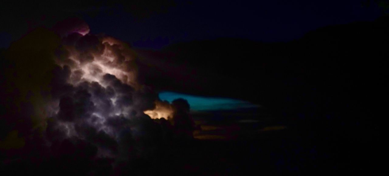 night, scenics, dark, power in nature, sky, low angle view, tranquility, tranquil scene, majestic, beauty in nature, mystery, cloud - sky, nature, glowing, environment, illuminated, moon, atmosphere, storm cloud, ethereal, atmospheric mood, dramatic sky, thunderstorm, forked lightning, ominous, moonlight, exploration, cloudscape, outdoors