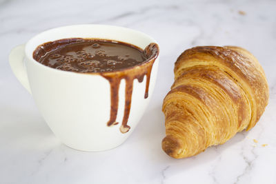 Close-up of coffee served on table