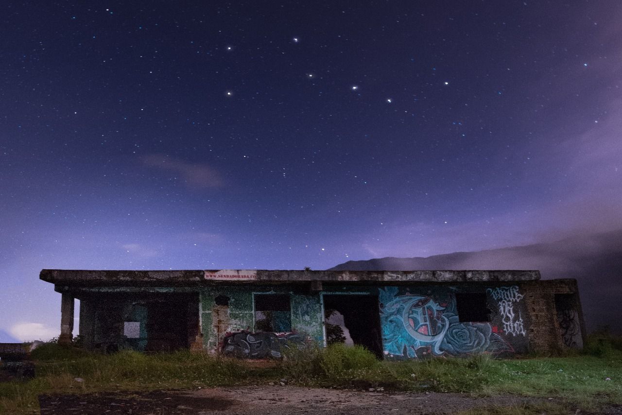 astronomy, sky, architecture, abandoned, built structure, night, no people, outdoors, star - space, building exterior, grass, starry, galaxy, nature