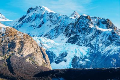 Panoramic view of glacier on mountain against sky