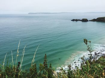 Scenic view of calm sea against clear sky