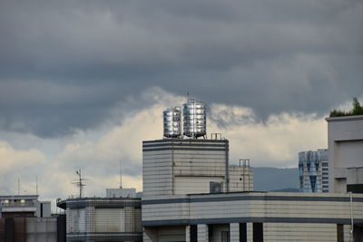 Buildings in city against sky