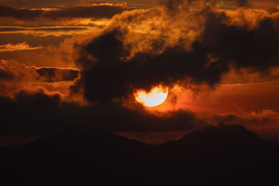 Scenic view of dramatic sky during sunset