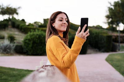 Young woman using mobile phone