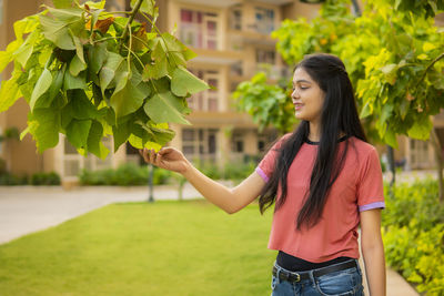 Young woman holding flower