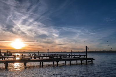 Silhouette of pier at sunset