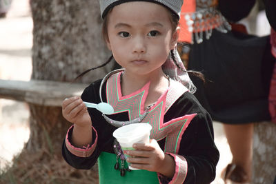 Portrait of a girl drinking from drink