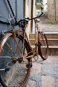 Bicycle leaning against wall