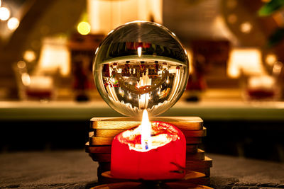 Close-up of illuminated lighting equipment on table