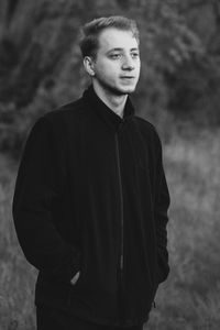 Portrait of young man standing outdoors