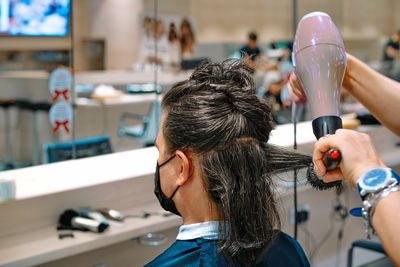 Man with long hair at hair salon