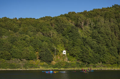 Stand up padling at hammeren harbour, bornholm, denmark