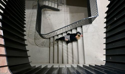 High angle view of woman on staircase