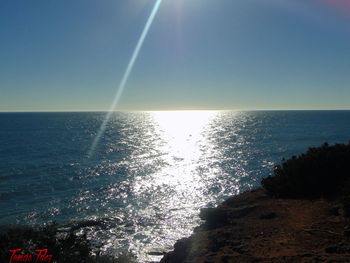 Close-up of sea against sky during sunset